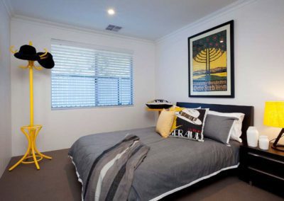 bedroom with pops of colour and venetian blinds
