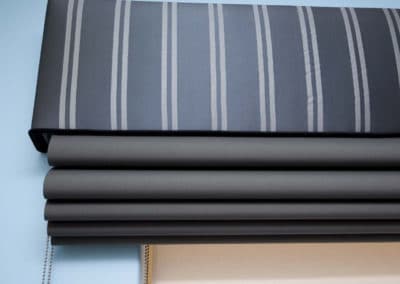 grey roman blinds with striped pelmet
