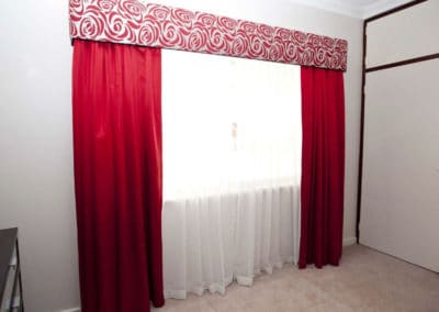 red curtains with floral pelmet