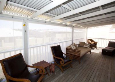 white rope and pulley blinds on elevated deck patio