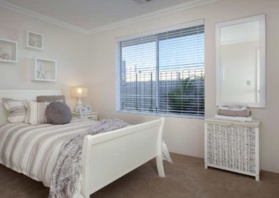 white venetian blinds in bedroom